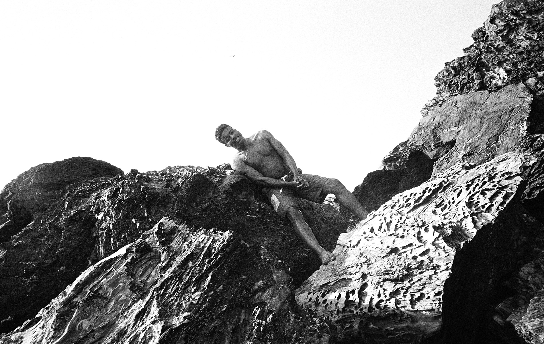 Remi leaning on a rock